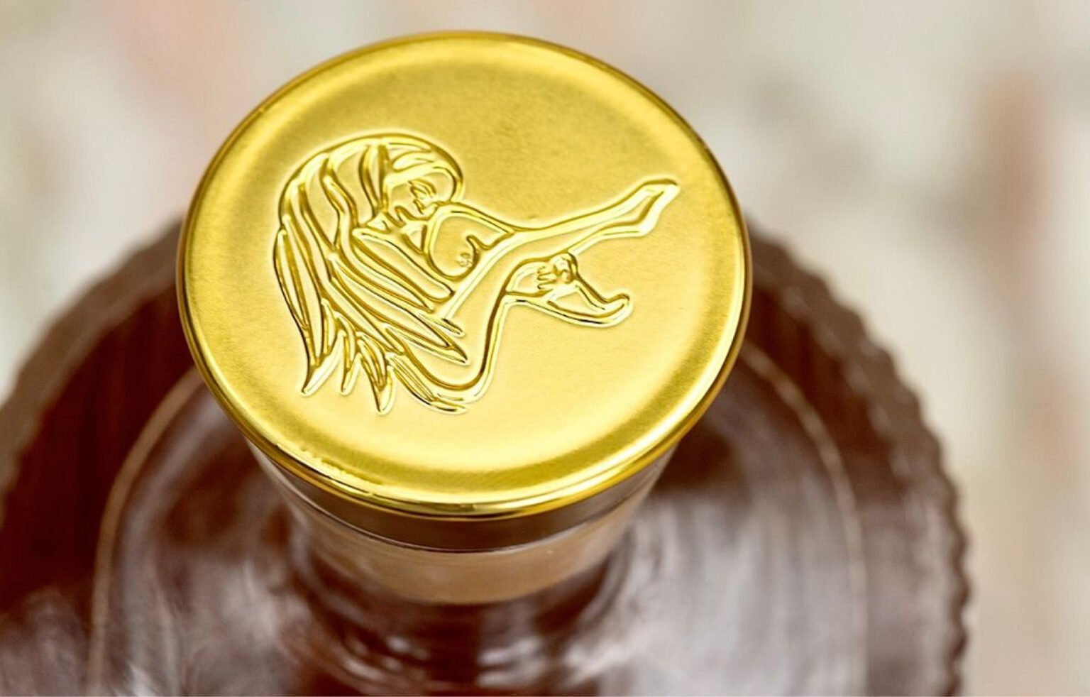 Close-up of the Casa Malka Tequila cork with gold detailing and intricate design