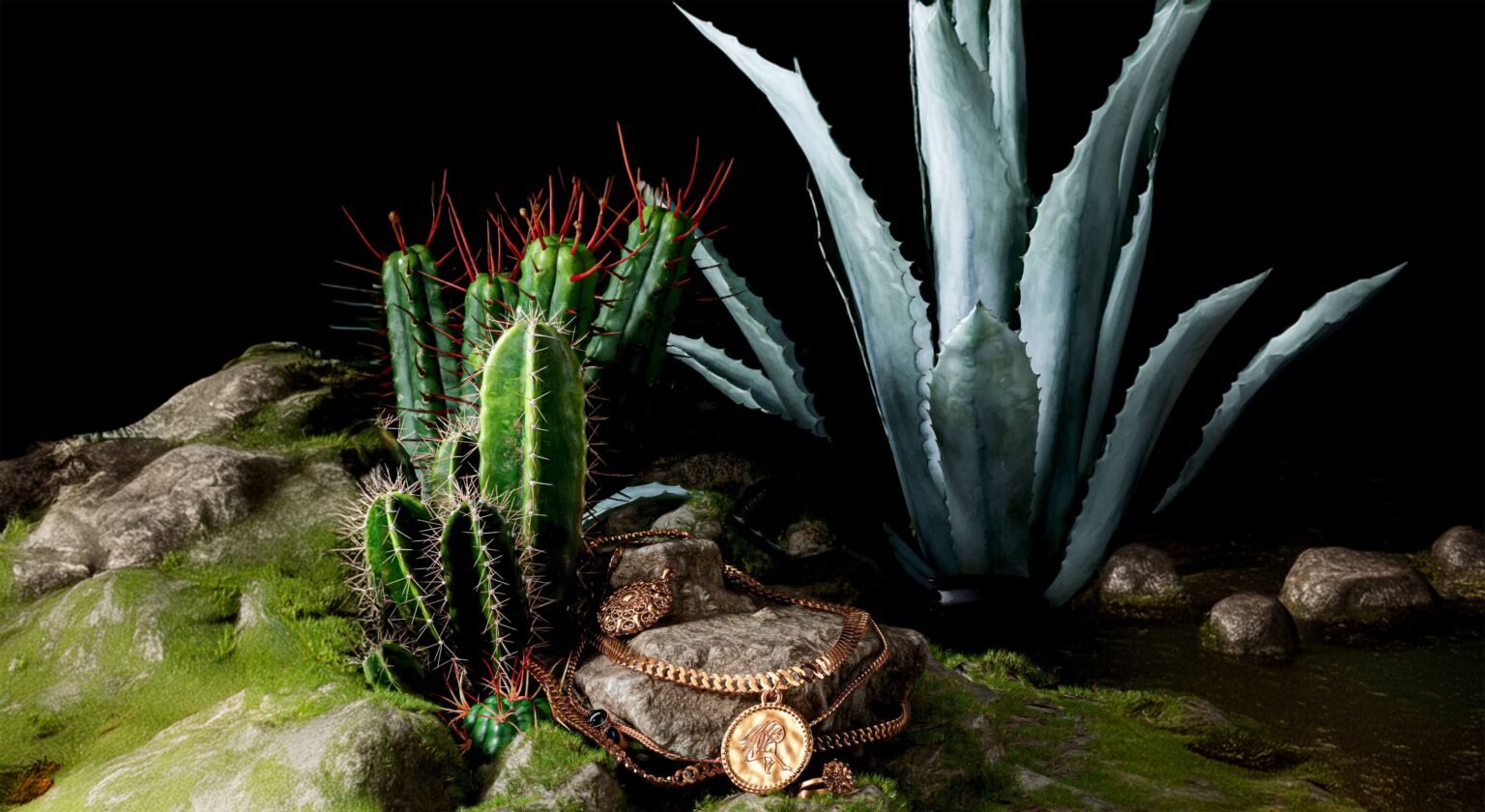 Casa Malka Tequila bottle with cactus background and necklaces draped over, blending tradition and elegance